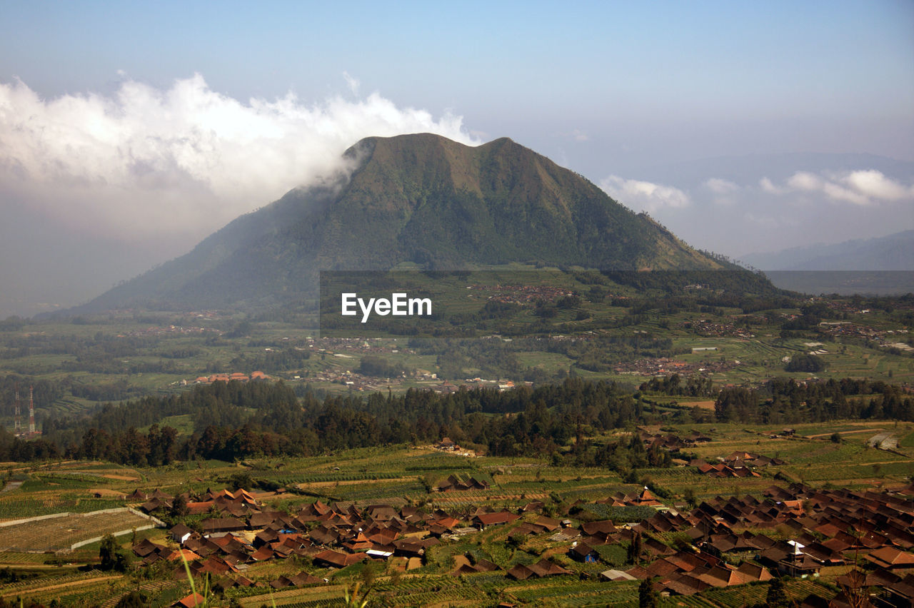 Scenic view of landscape and mountains against sky