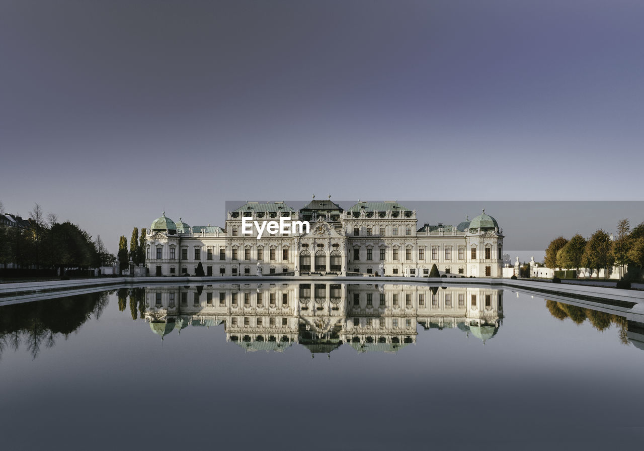 REFLECTION OF BUILDINGS IN LAKE WATER