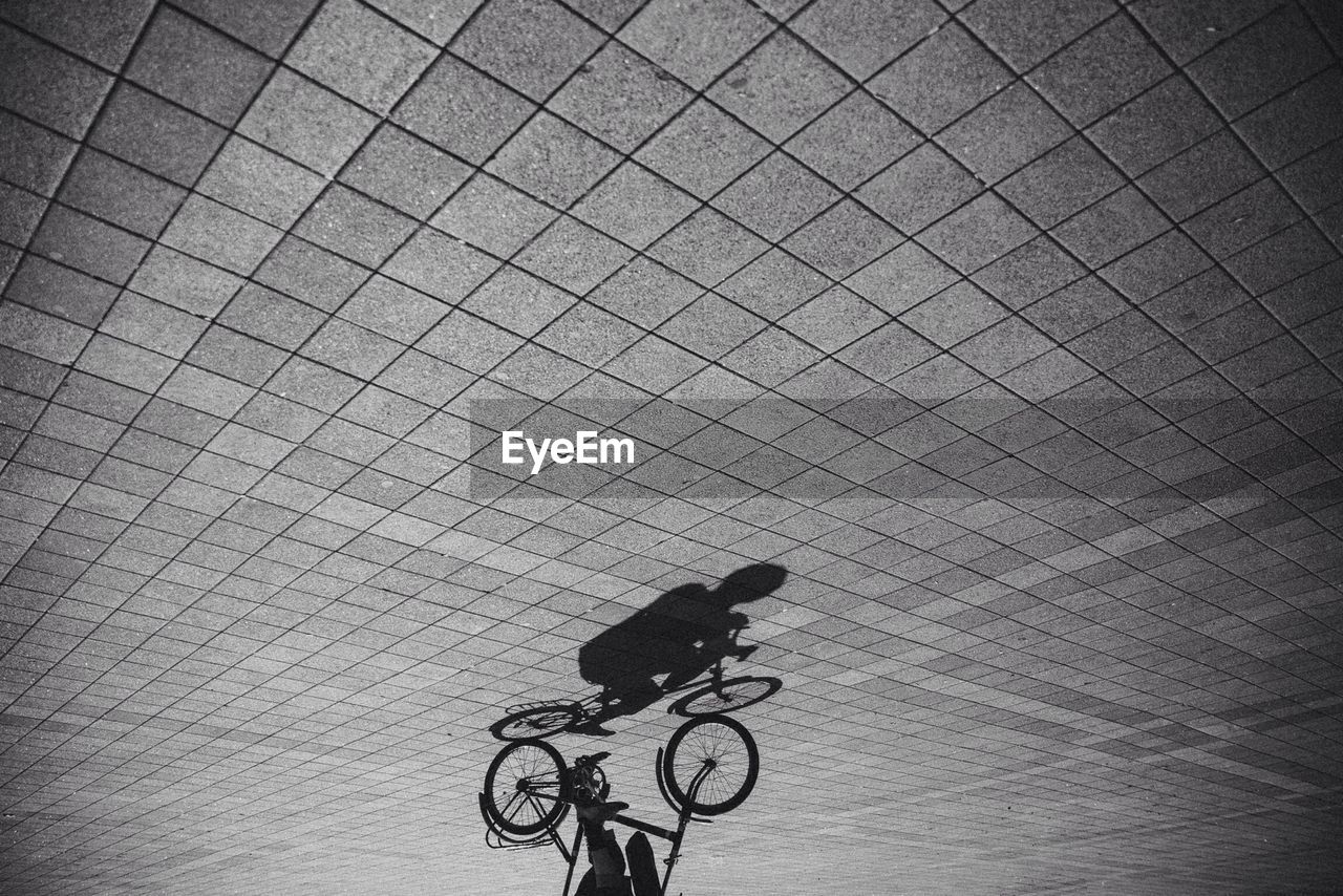 Upside down shot of person riding bicycle