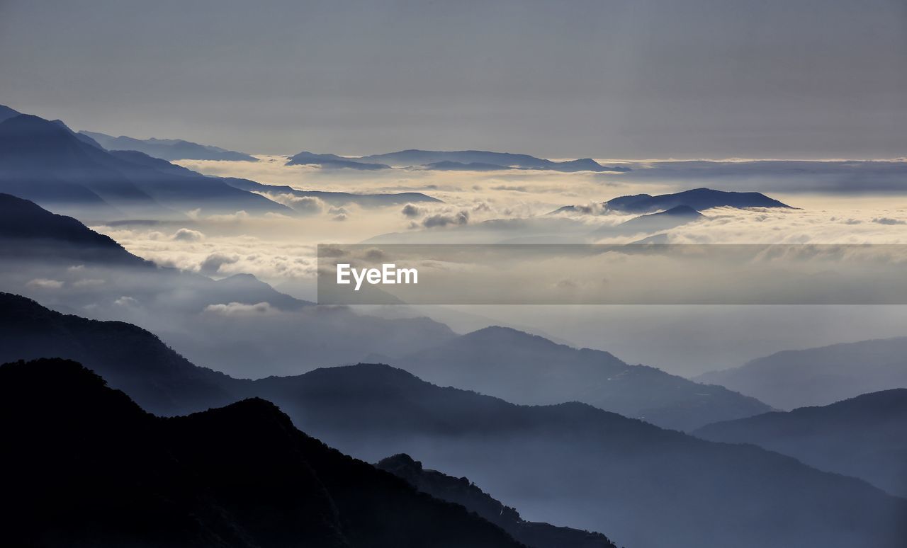 Scenic view of mountains against sky during sunset