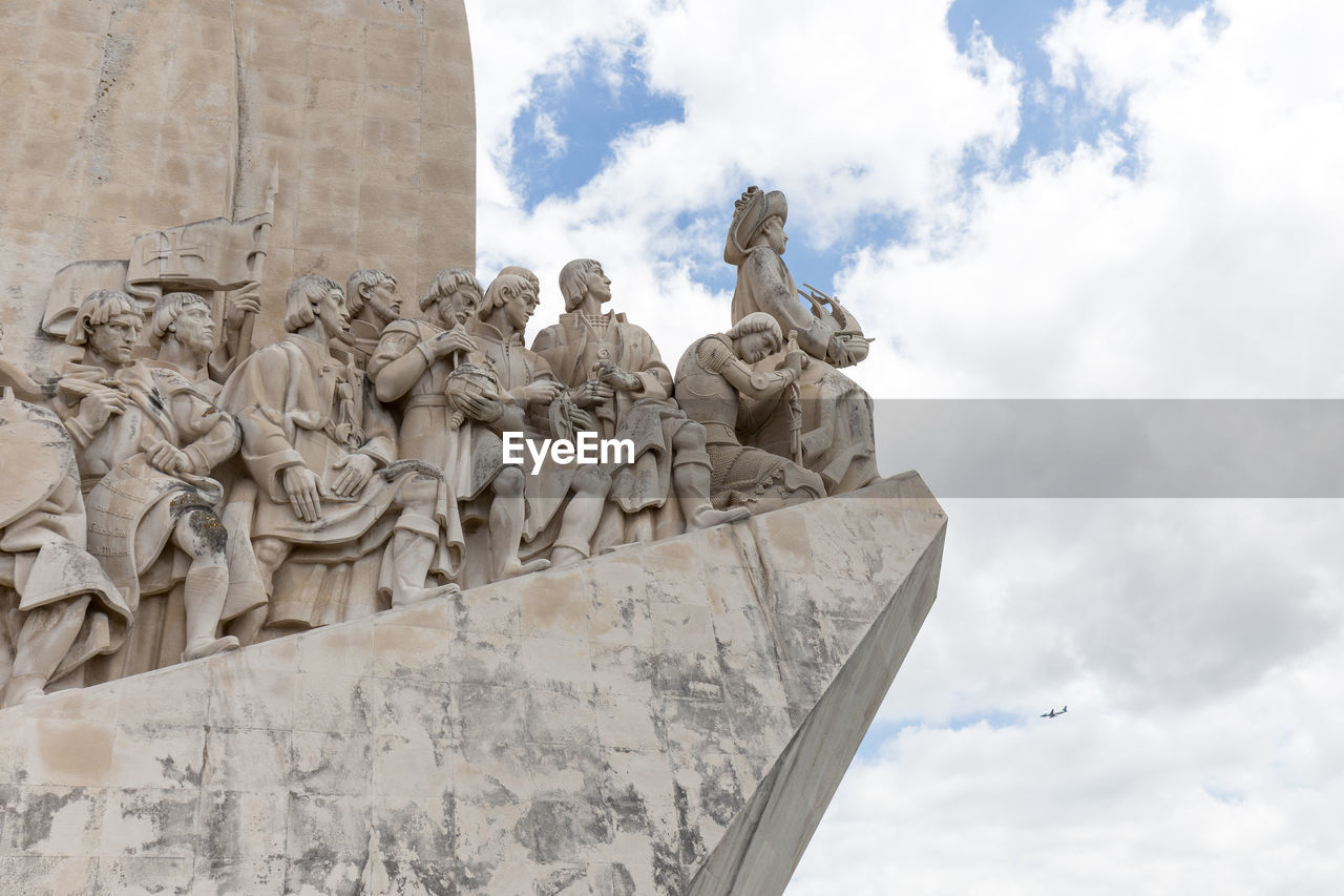 Monument to the discoveries against cloudy sky