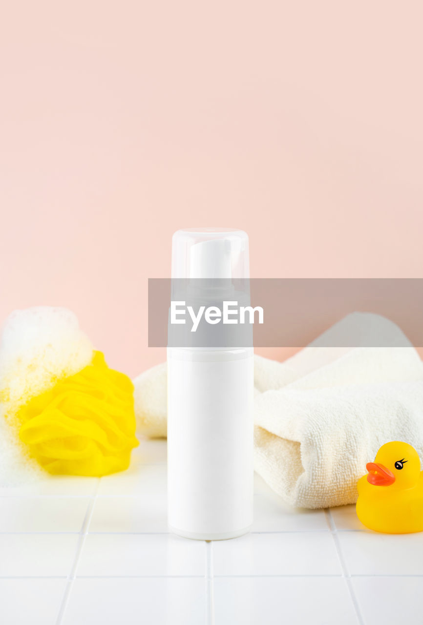 Natural hypoallergenic foam for bathing children. white plastic pump bottle. children's cosmetics.