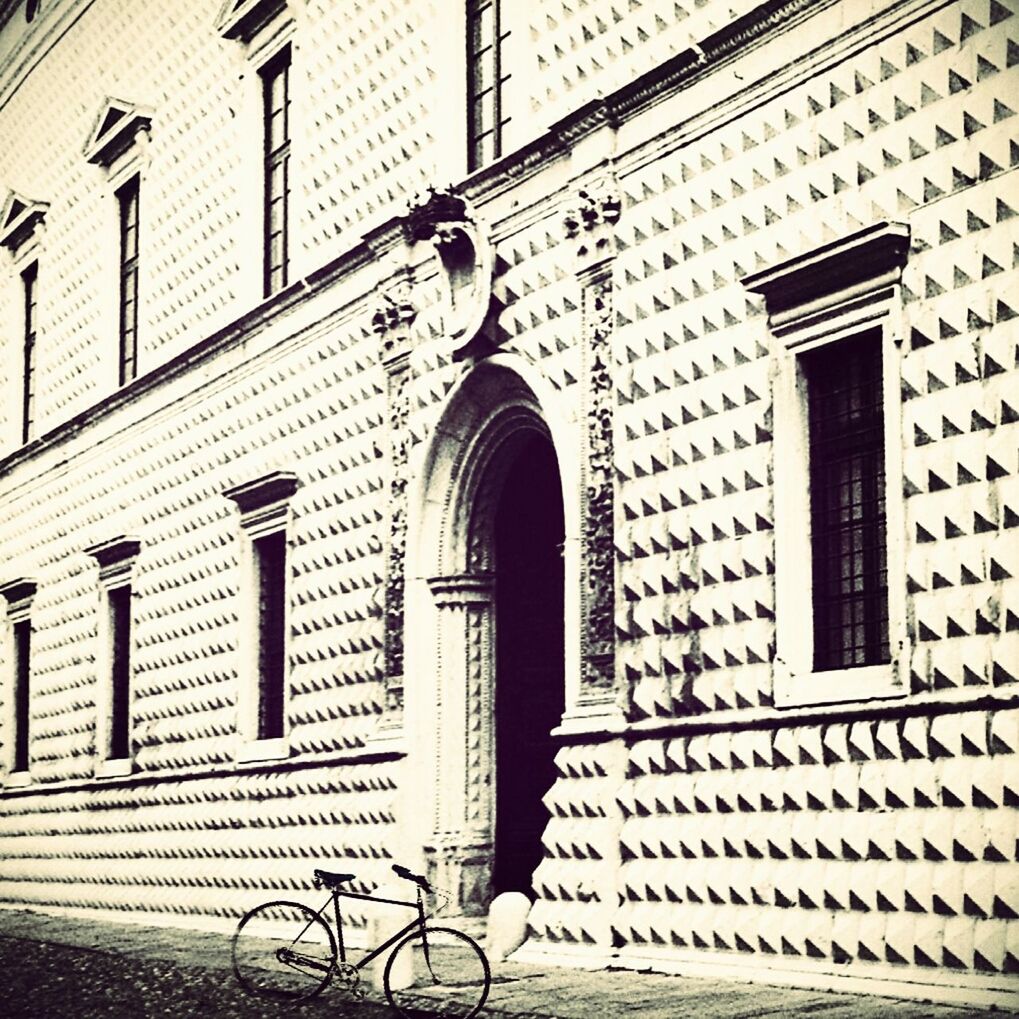 Bicycle parked by building