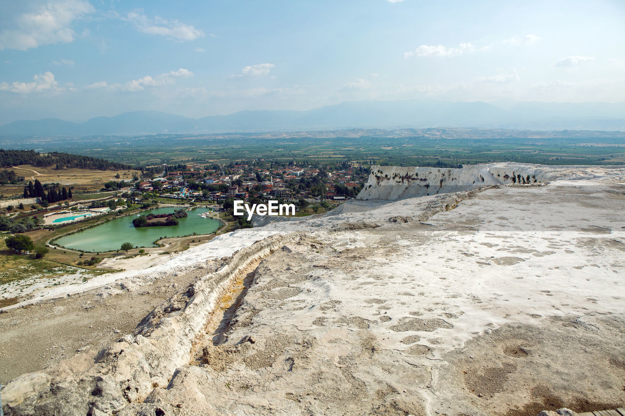 White calcium mountain with granite with small waterfall in summer in pamukkale turkey