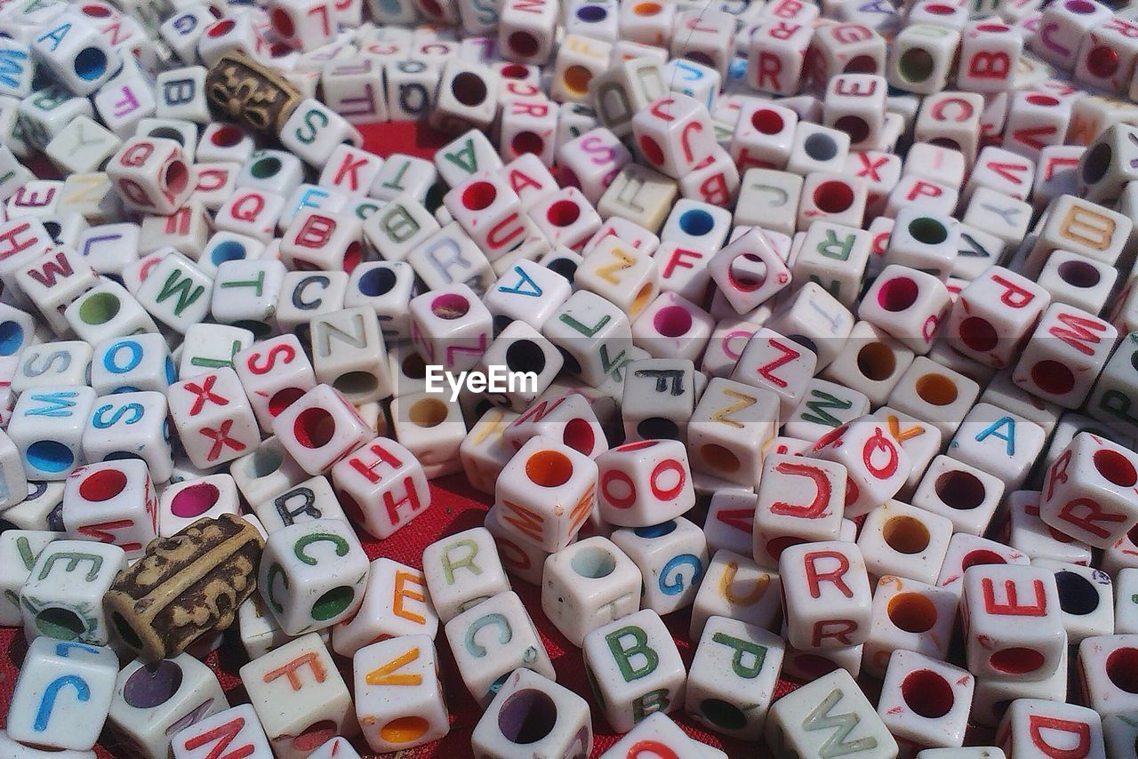 Full frame shot of multi colored alphabet beads