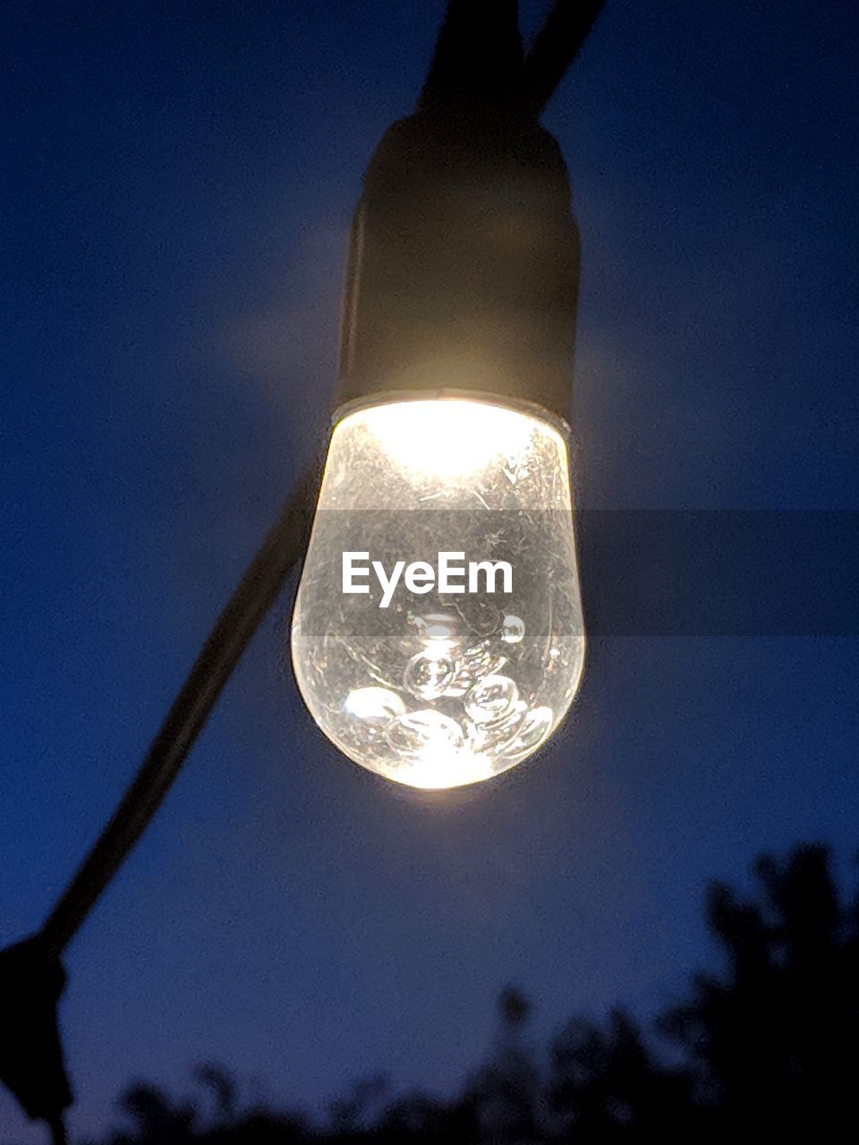 LOW ANGLE VIEW OF LIGHT BULB AGAINST SKY