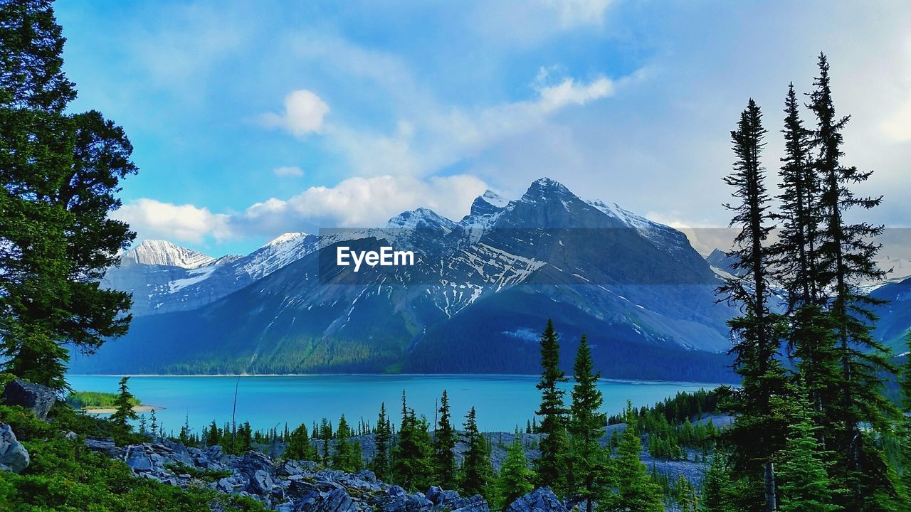 Scenic view of mountains against cloudy sky