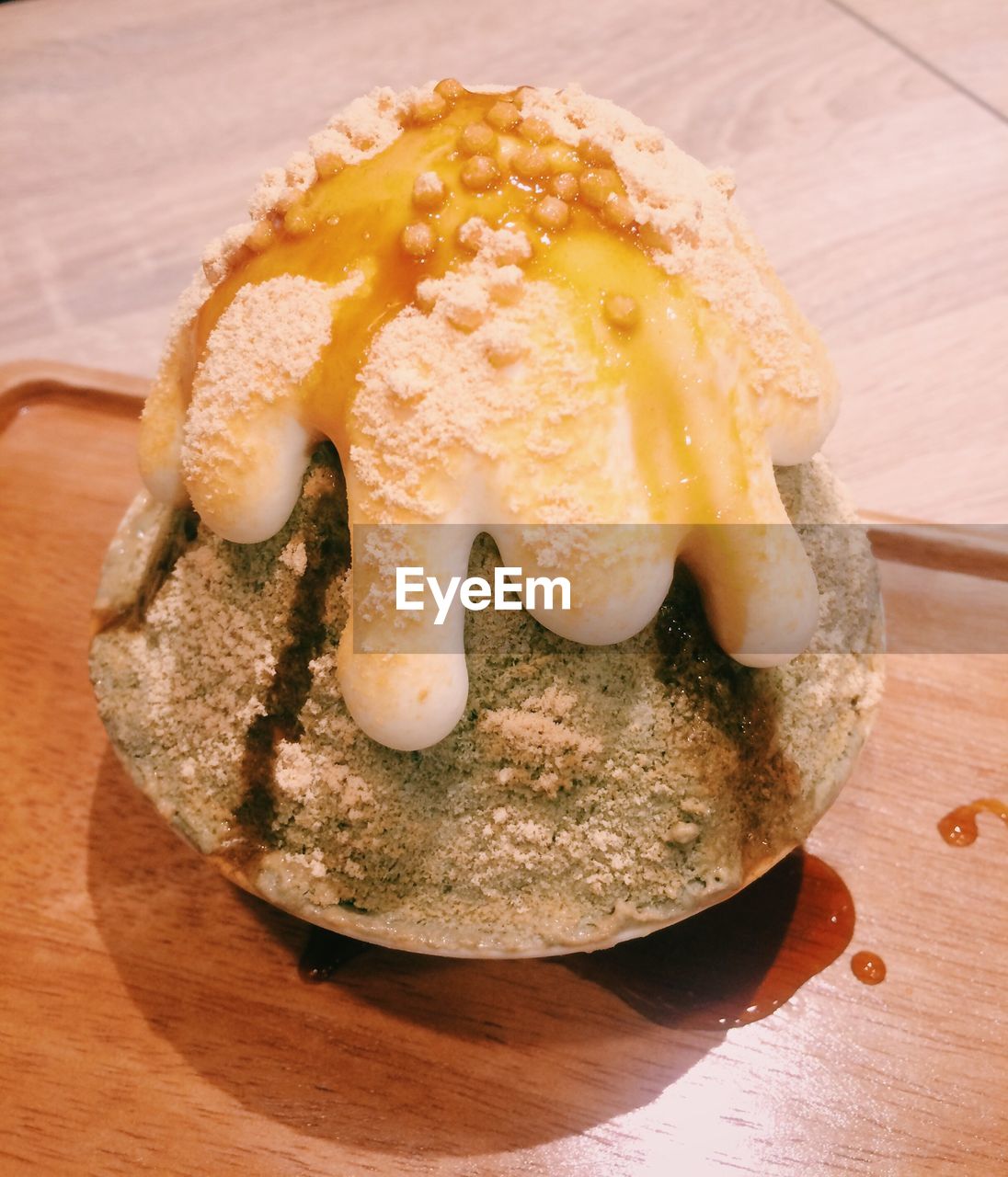 HIGH ANGLE VIEW OF ICE CREAM IN PLATE ON TABLE