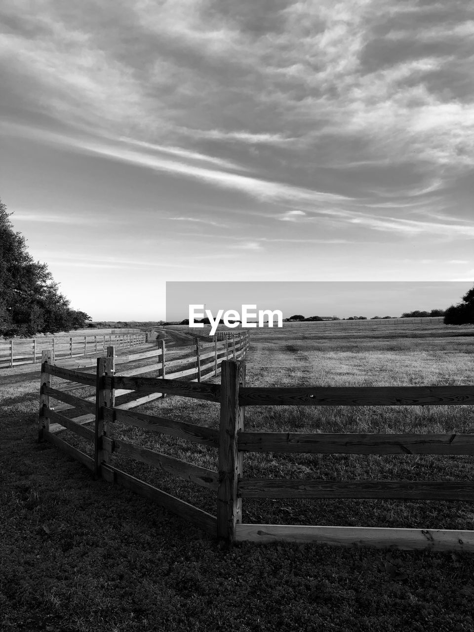 FENCE ON LANDSCAPE AGAINST SKY