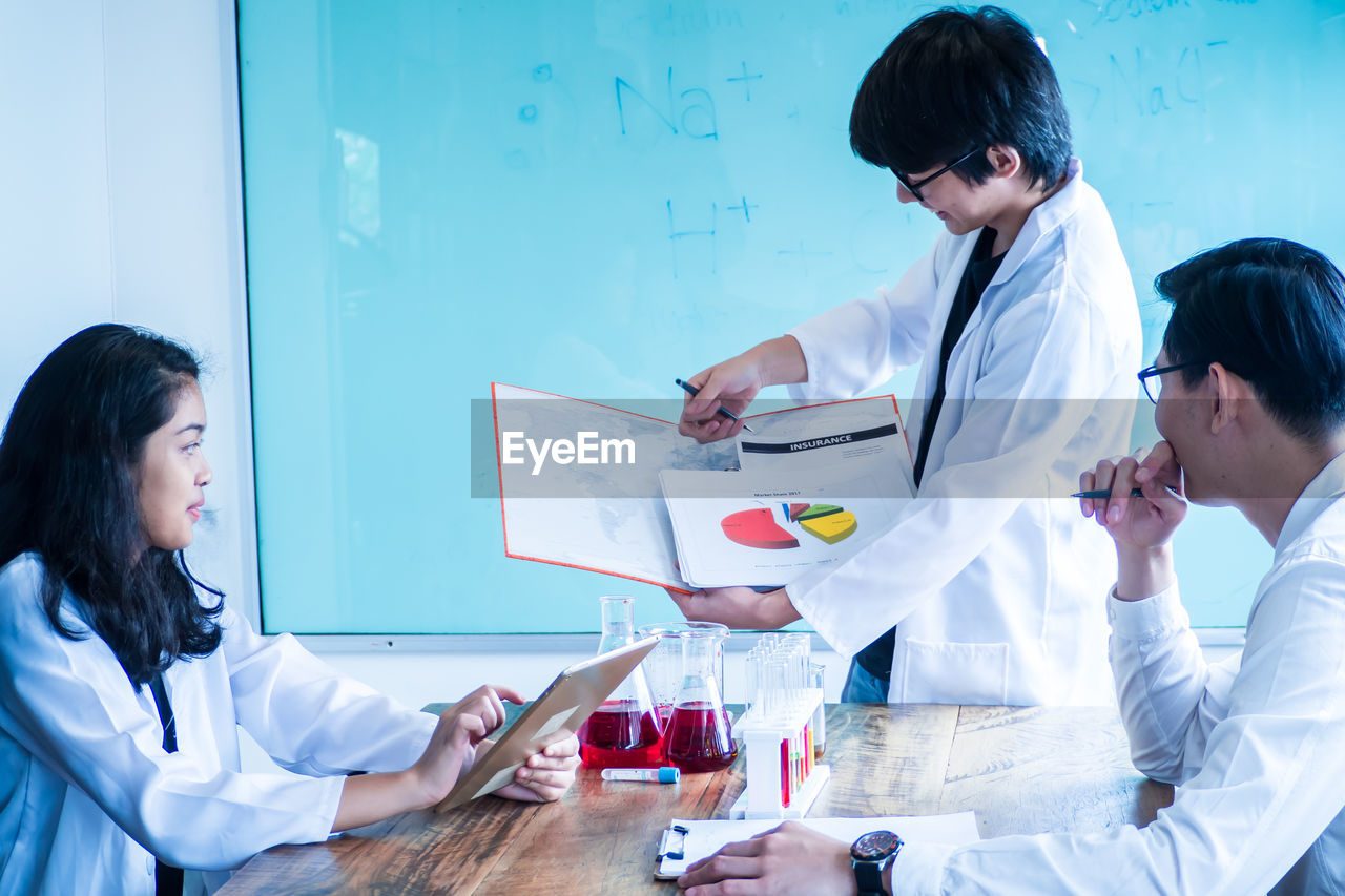 Scientists discussing in laboratory