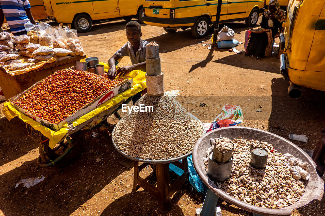 PEOPLE AT MARKET STALL