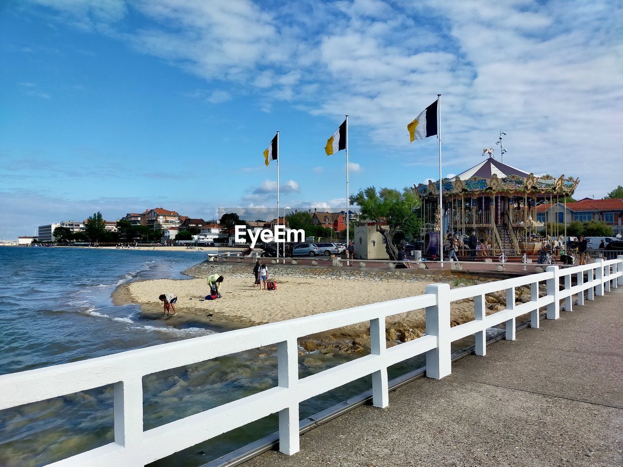 People on beach by sea against sky in arcachon in france 