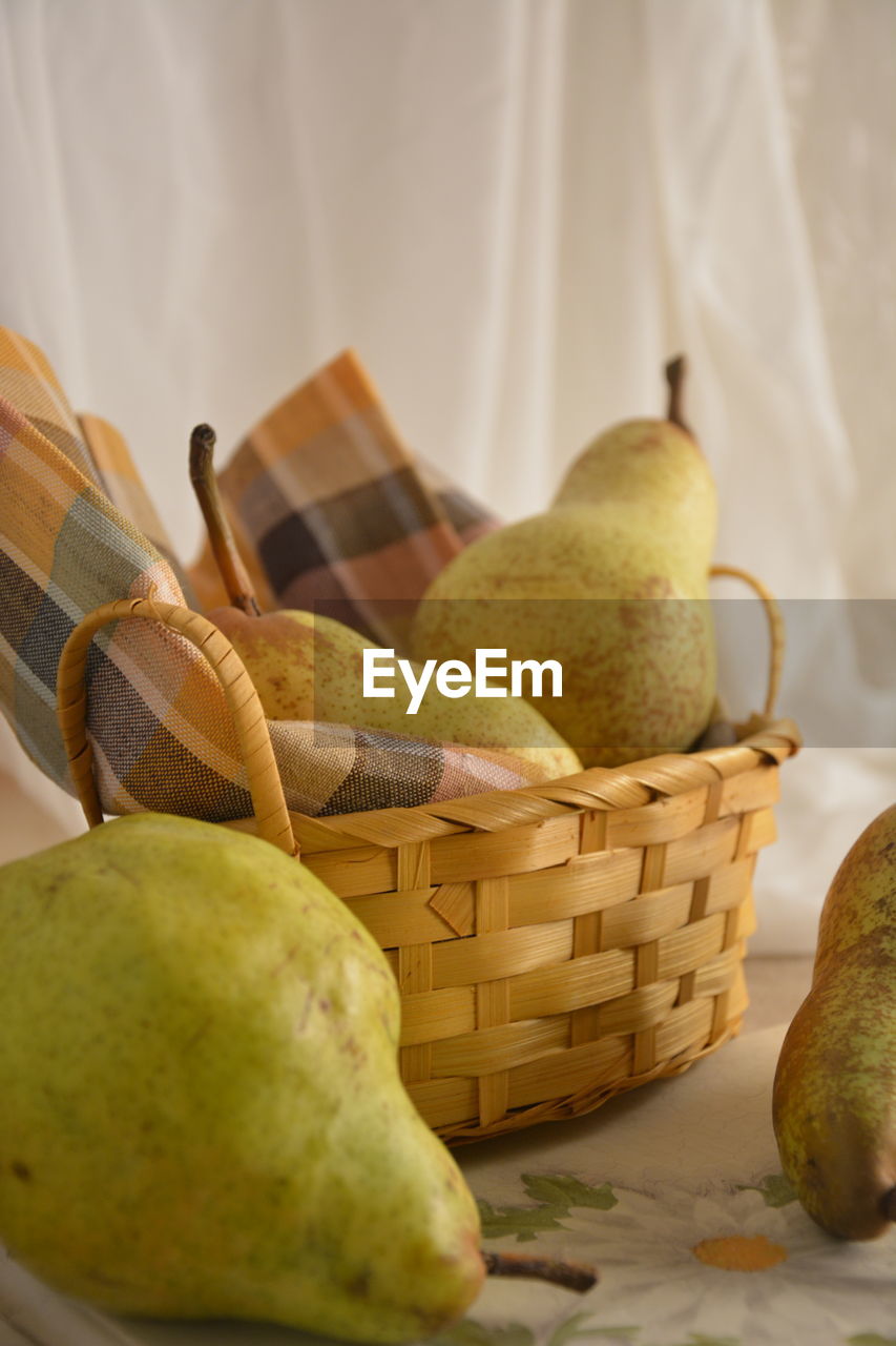 CLOSE-UP OF BANANAS ON BASKET