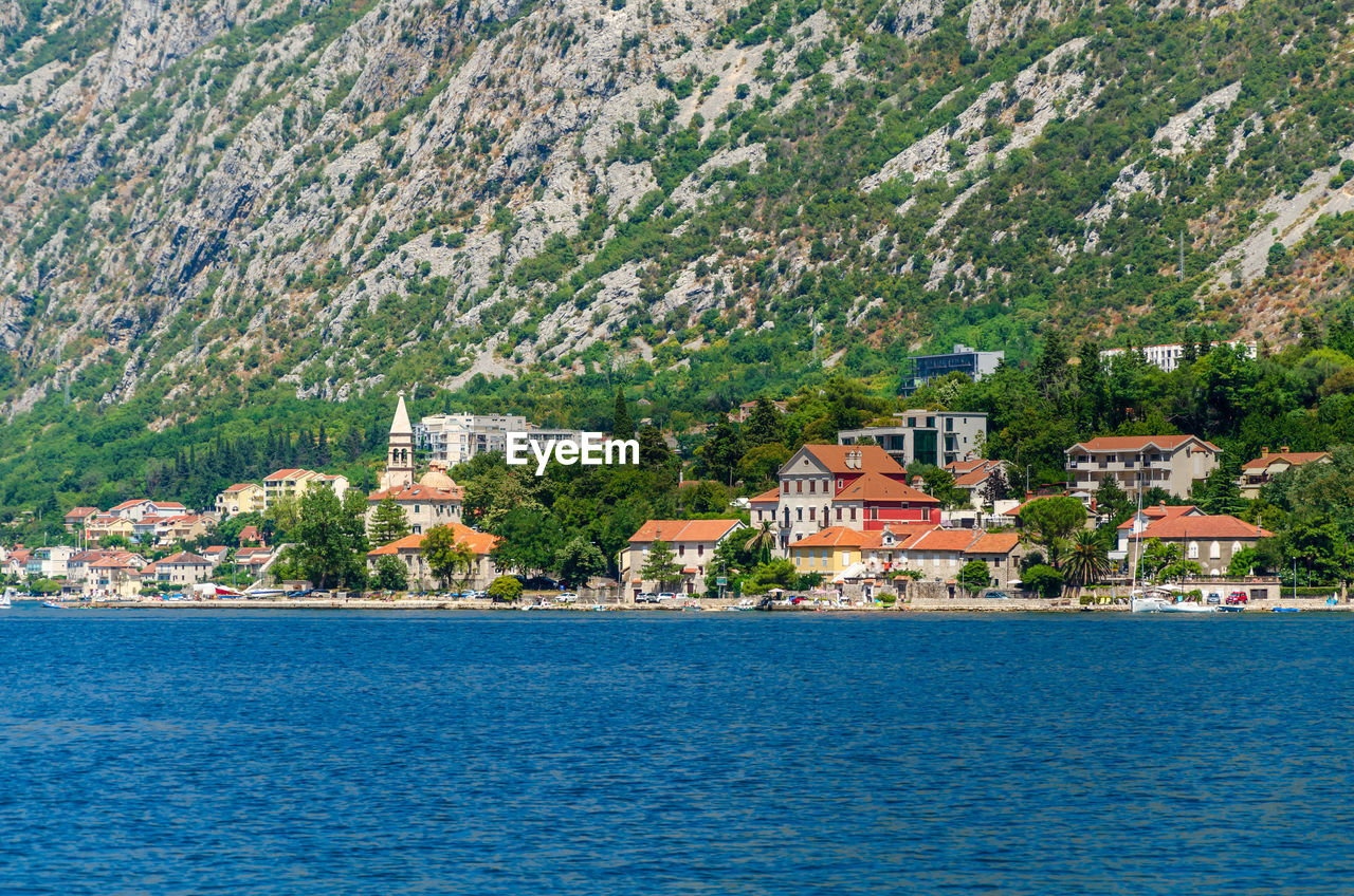 Small mediterranean town of dobrota, in the bay of kotor shot from the sea