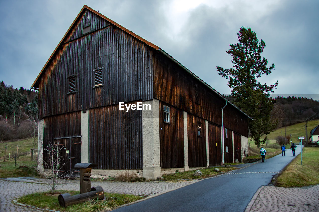 VIEW OF ROAD BY BUILDING AGAINST SKY