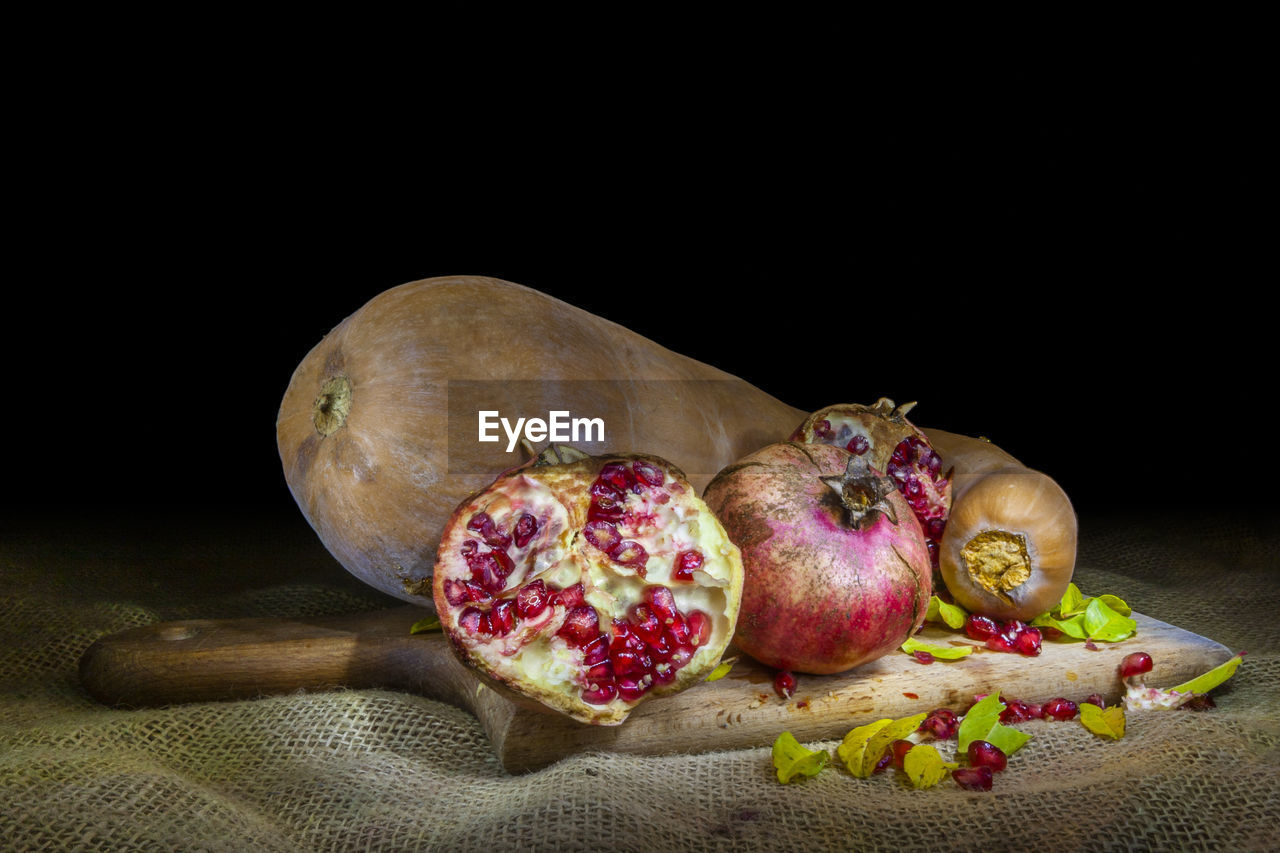 CLOSE-UP OF FRUITS ON TABLE