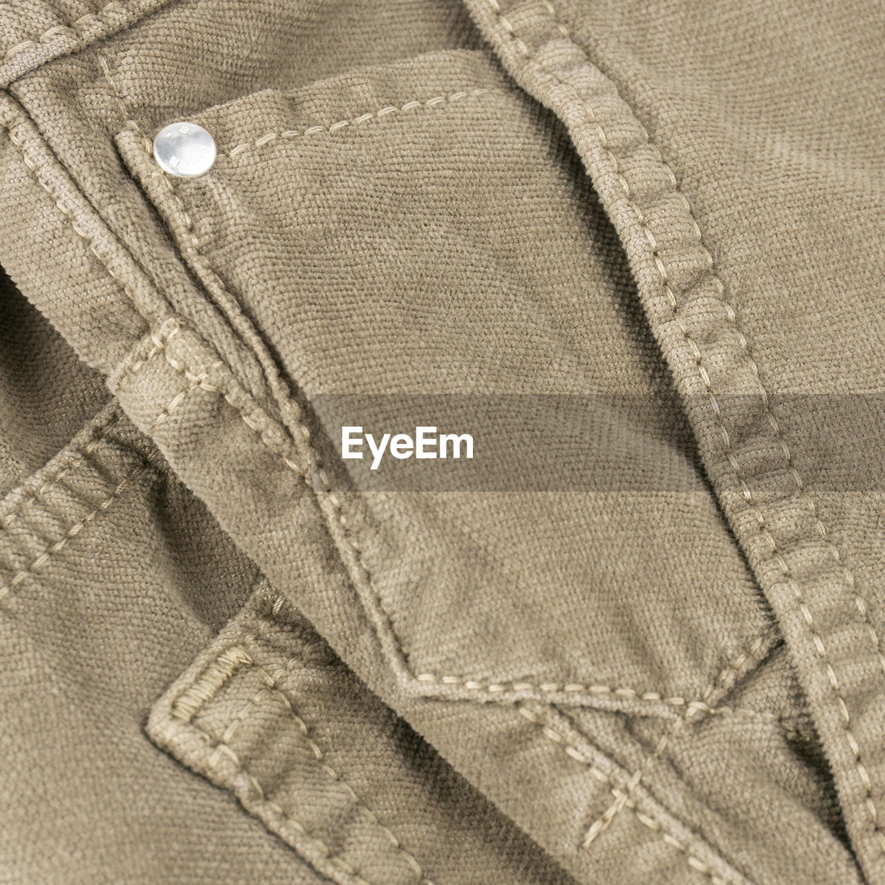 Beige mens velour pants pocket detail close up