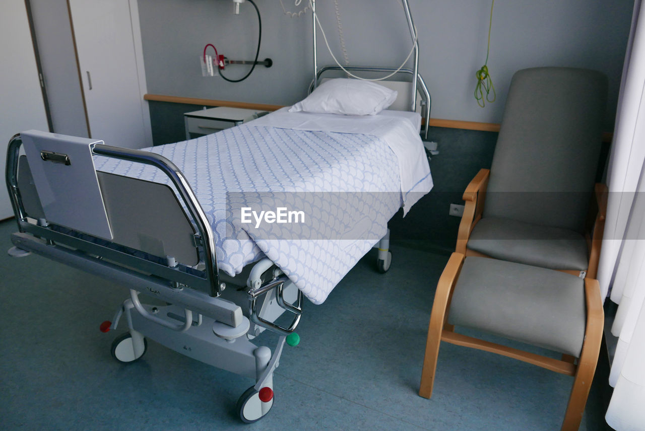 High angle view of empty bed in hospital