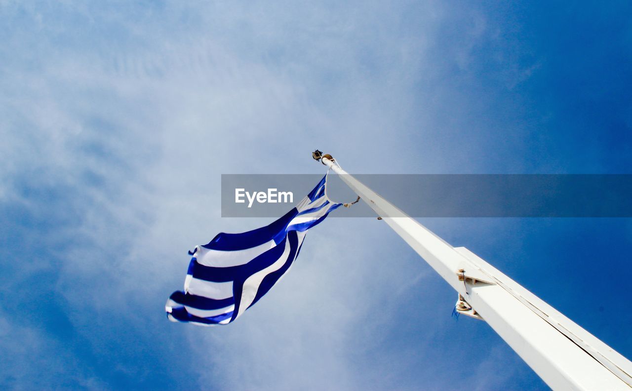 LOW ANGLE VIEW OF FLAG AGAINST SKY