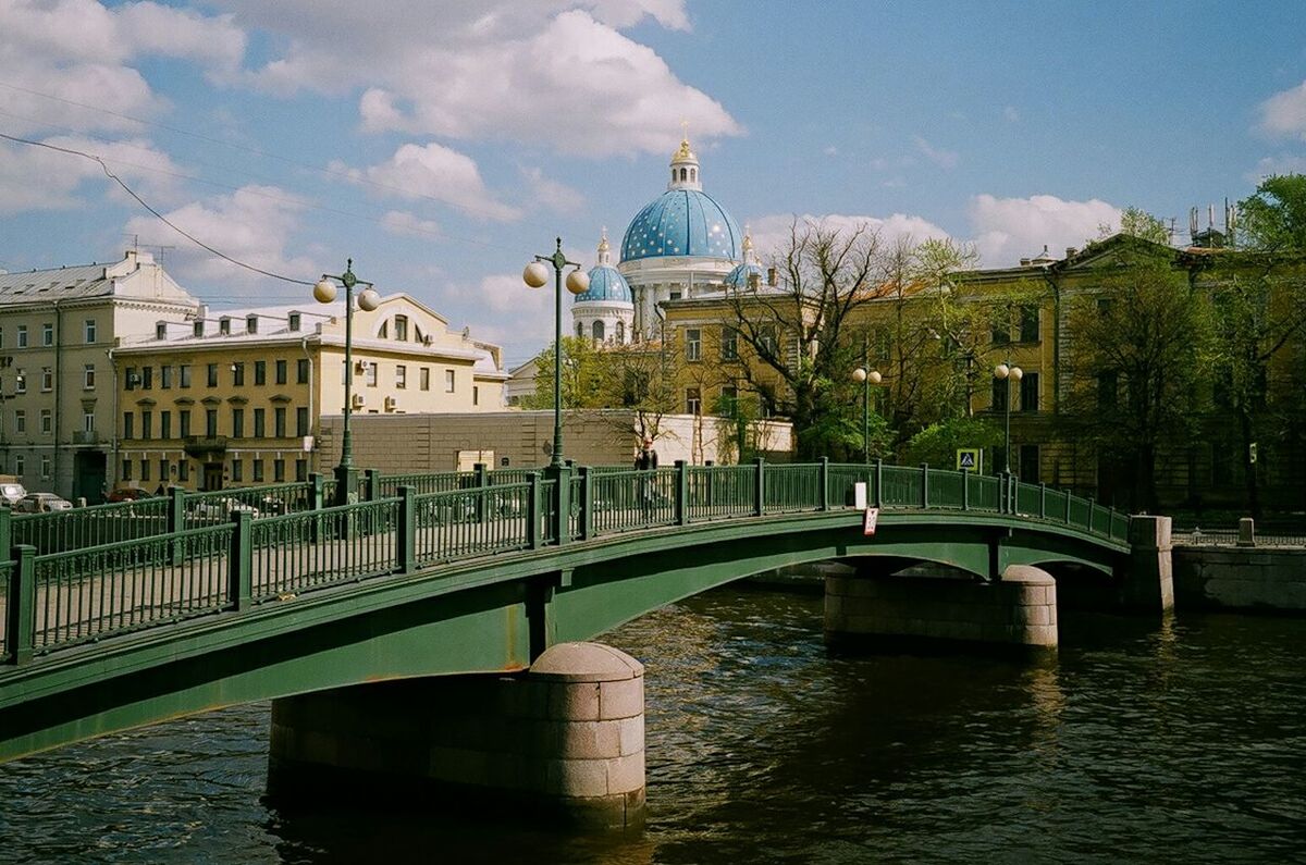 VIEW OF RIVER WITH BUILDINGS IN BACKGROUND