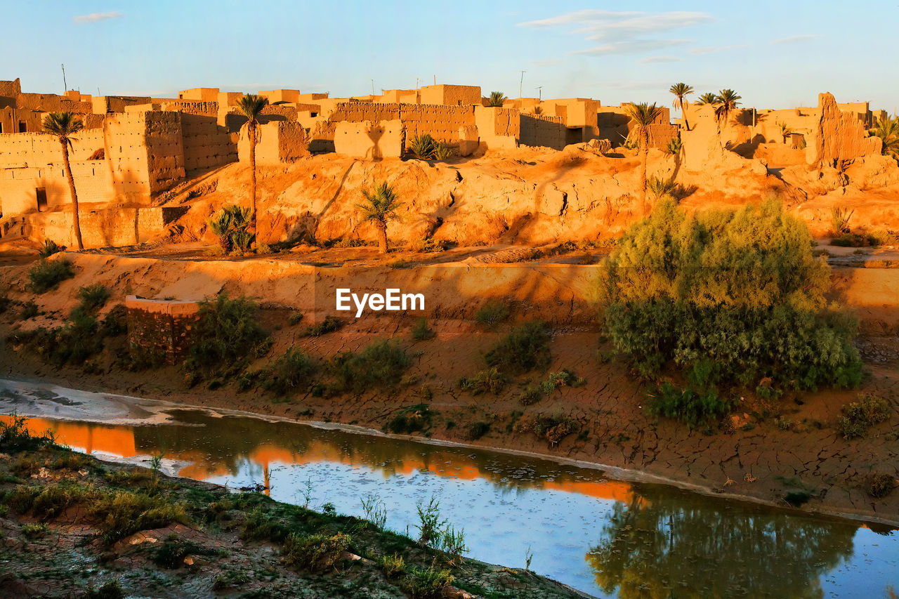 Townscape at erg chebbi desert against sky