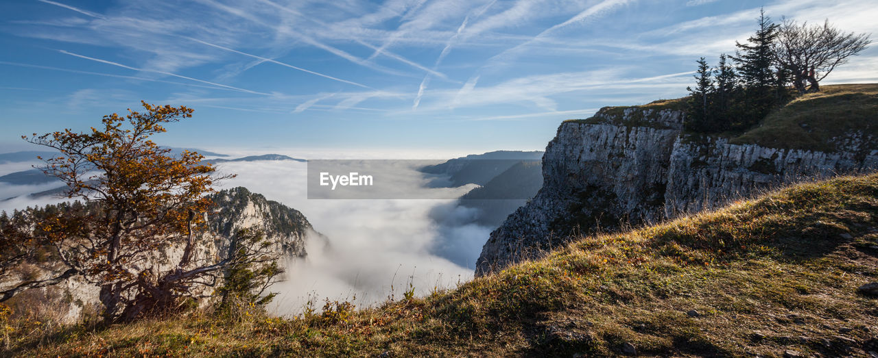 Scenic view of creux du van against sky