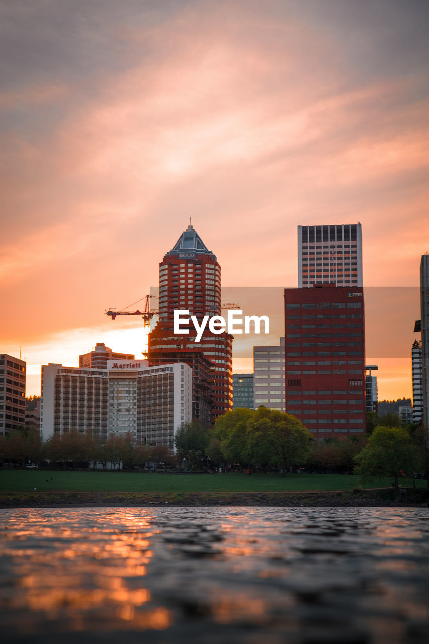 BUILDINGS AGAINST SKY DURING SUNSET