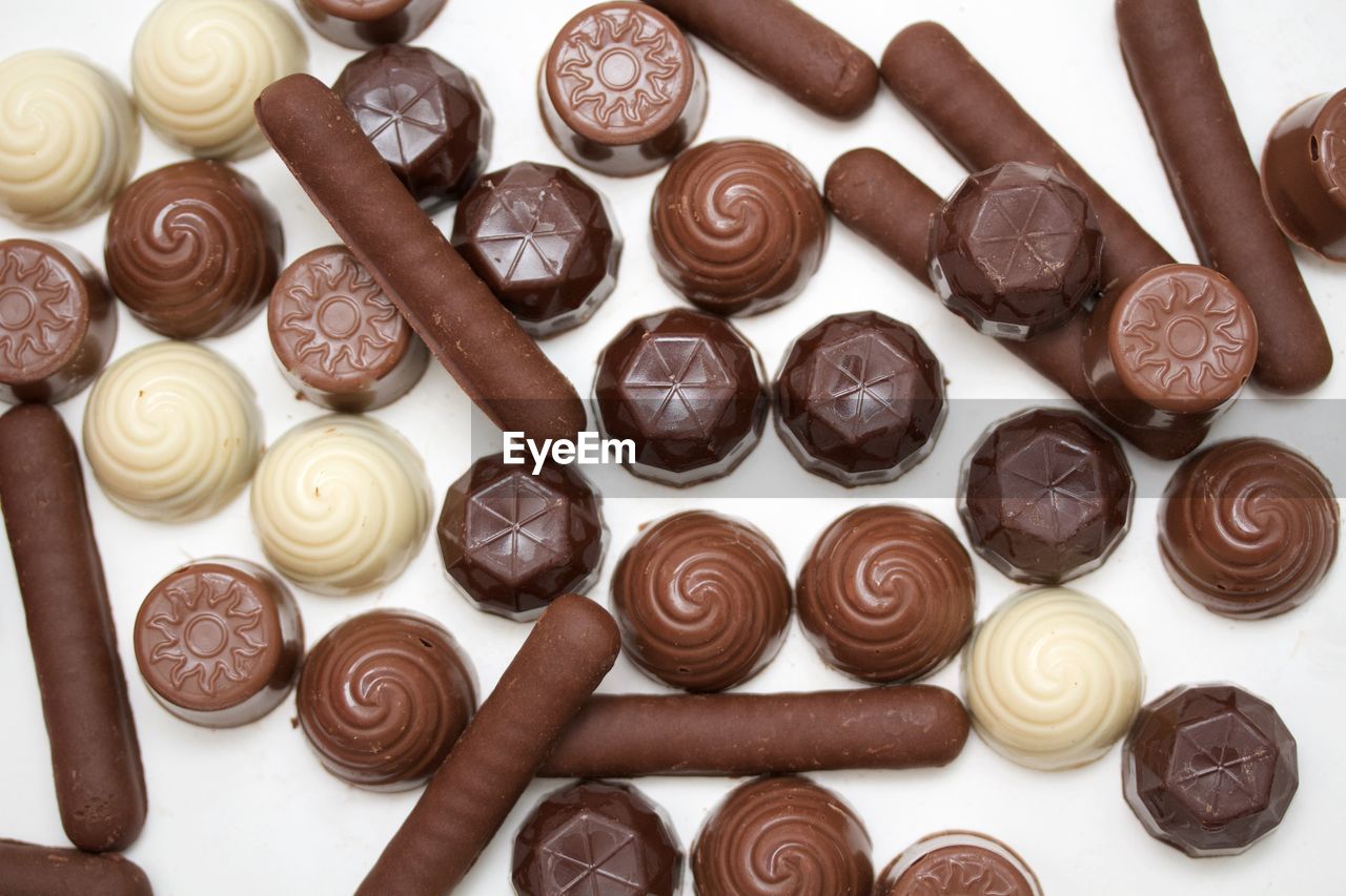 High angle view of chocolates on white background