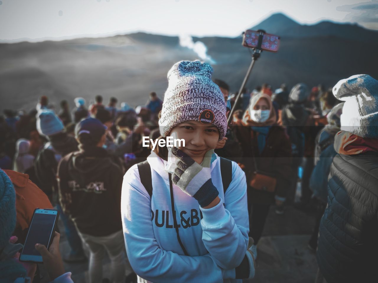 HIGH ANGLE VIEW PORTRAIT OF PEOPLE STANDING ON PHONE