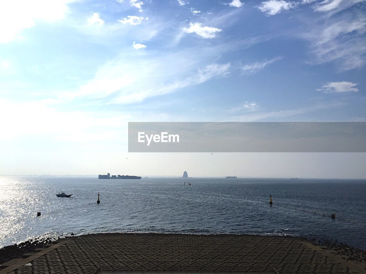 View of seascape against cloudy sky