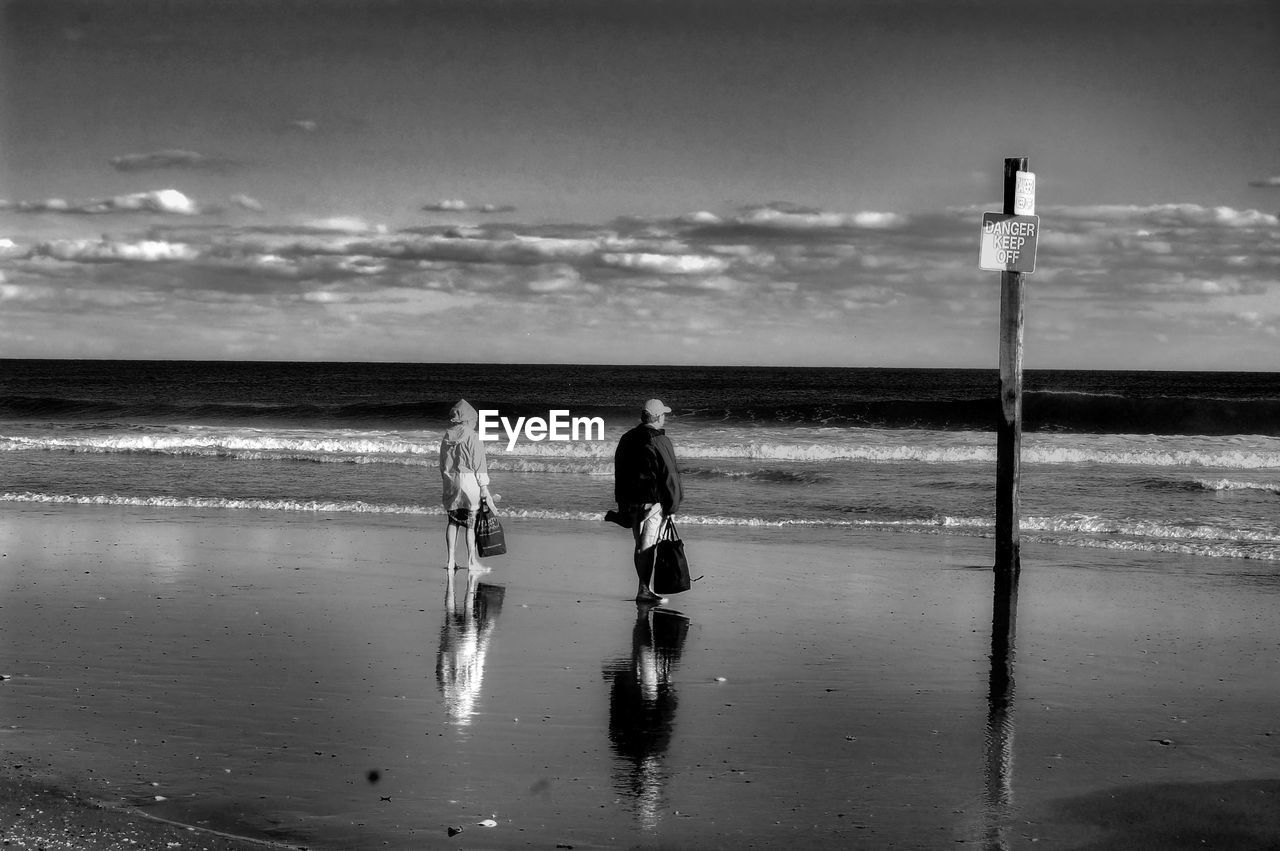 People standing on beach