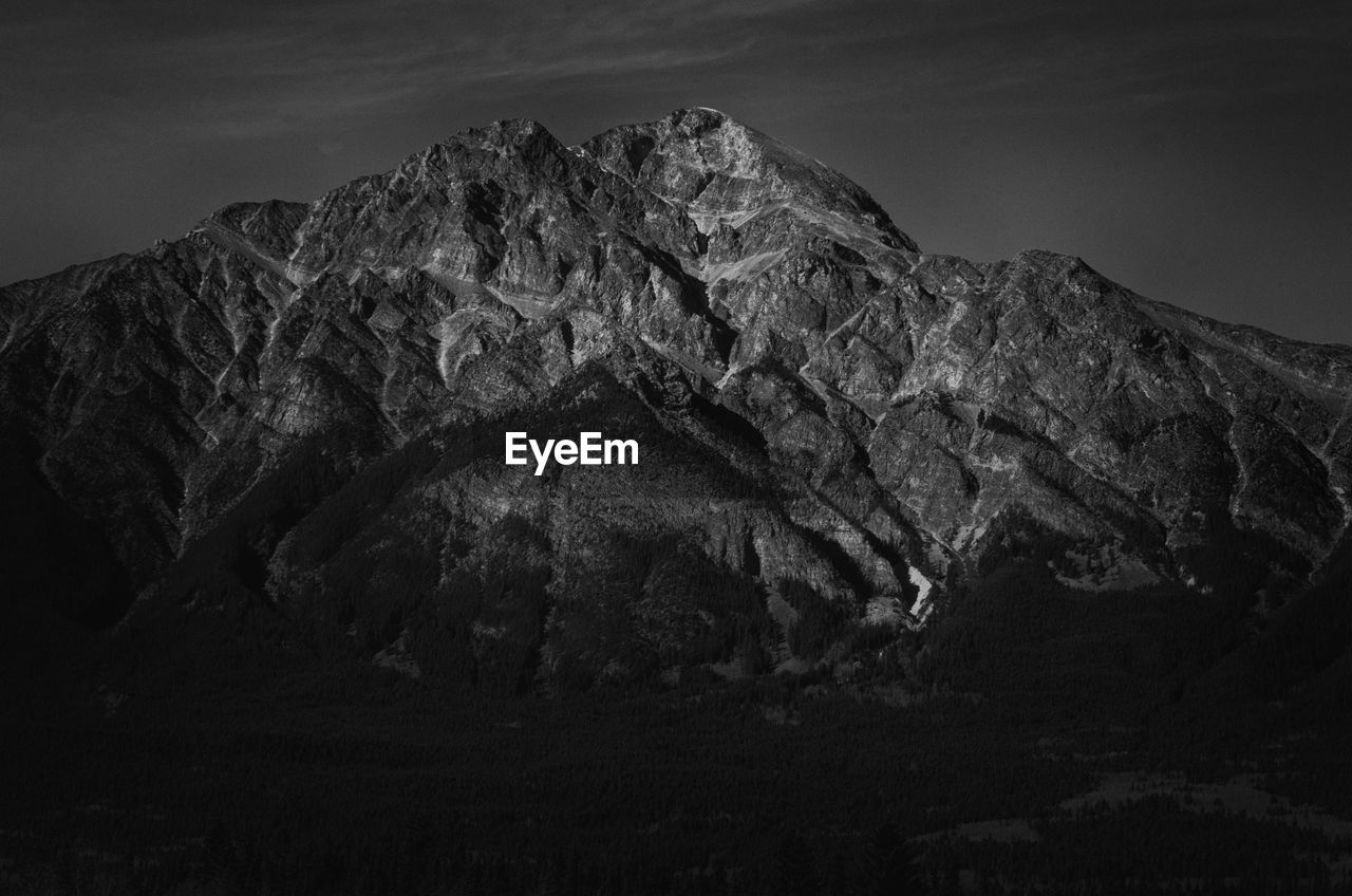 Low angle view of rock formation against sky