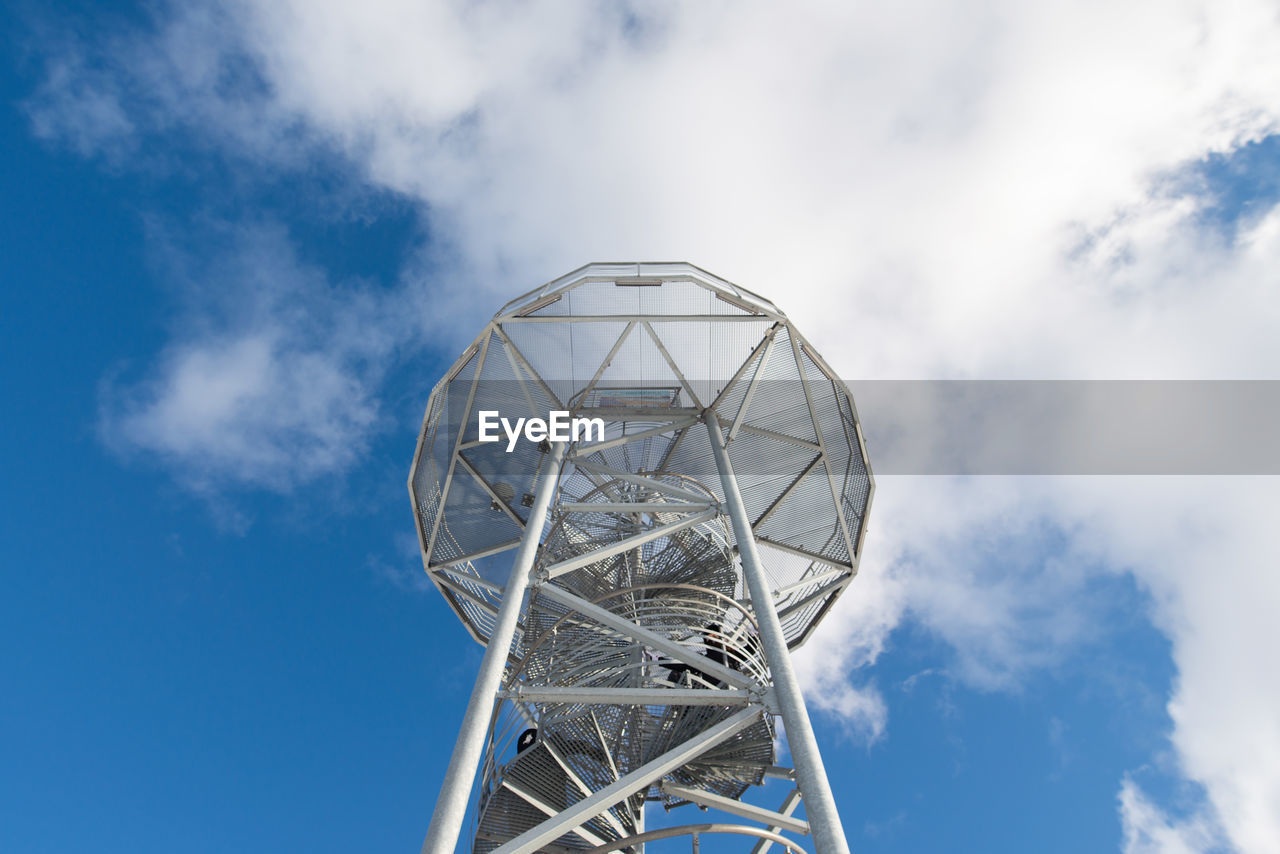 Low angle view of ferris wheel against sky