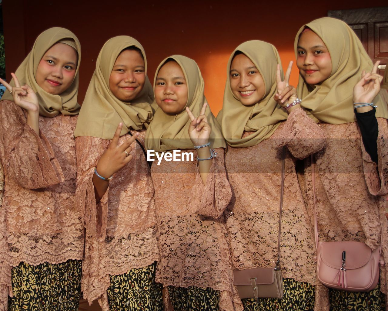 Kebaya is a traditional women's upper garment, long sleeves, worn with long fabrics that originate.