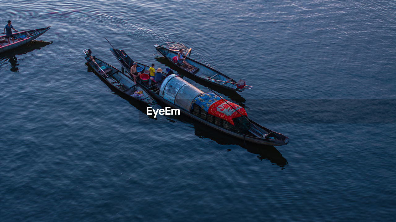 transportation, nautical vessel, water, mode of transportation, vehicle, high angle view, boat, boating, nature, sea, ship, watercraft, day, outdoors, aerial view, waterfront, group of people, on the move, motion, beauty in nature