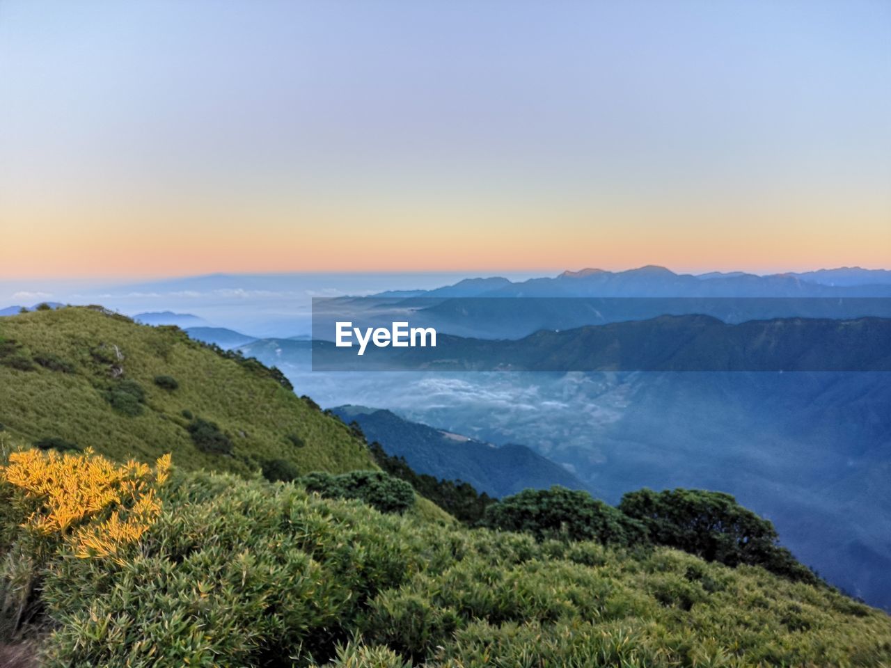 Scenic view of mountains against sky during sunset