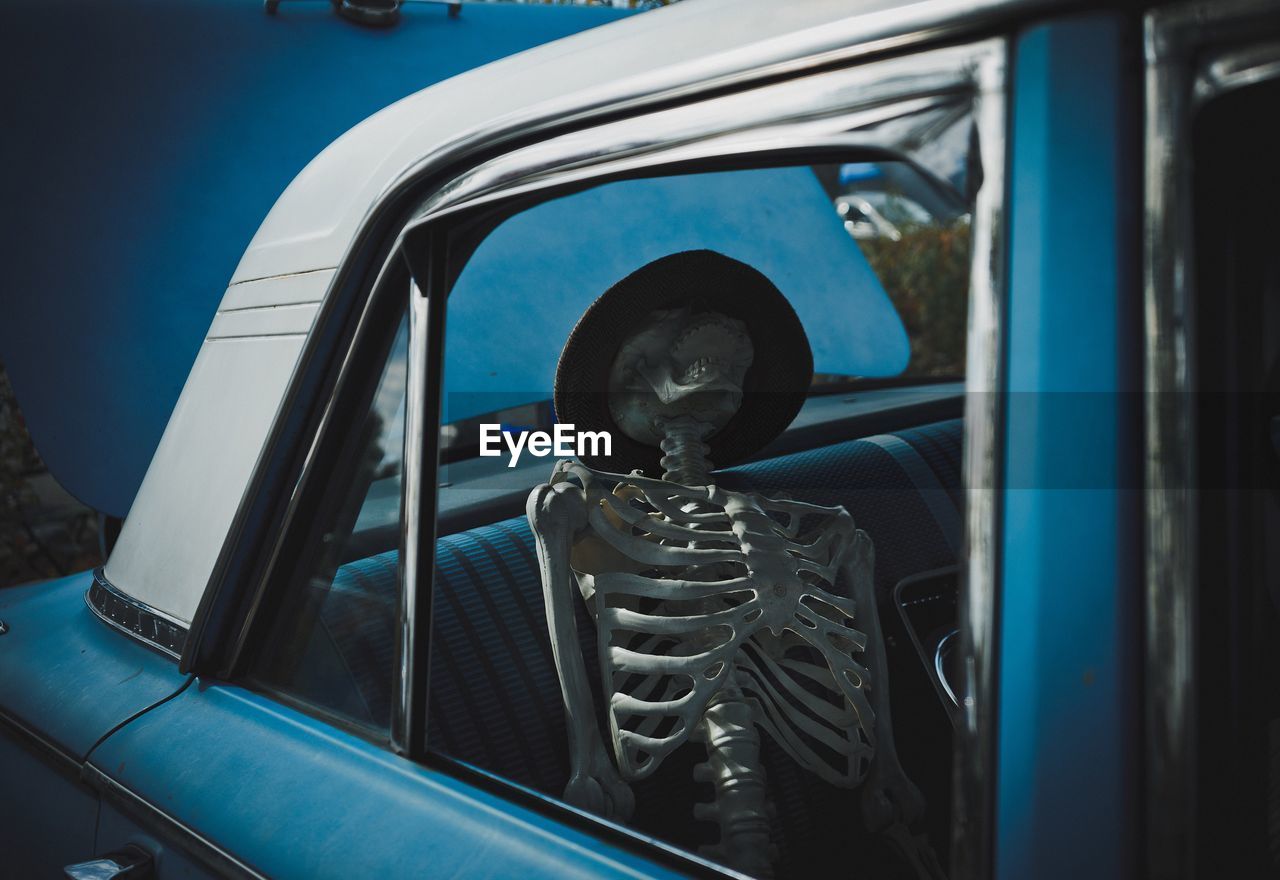 Skeleton in vintage car