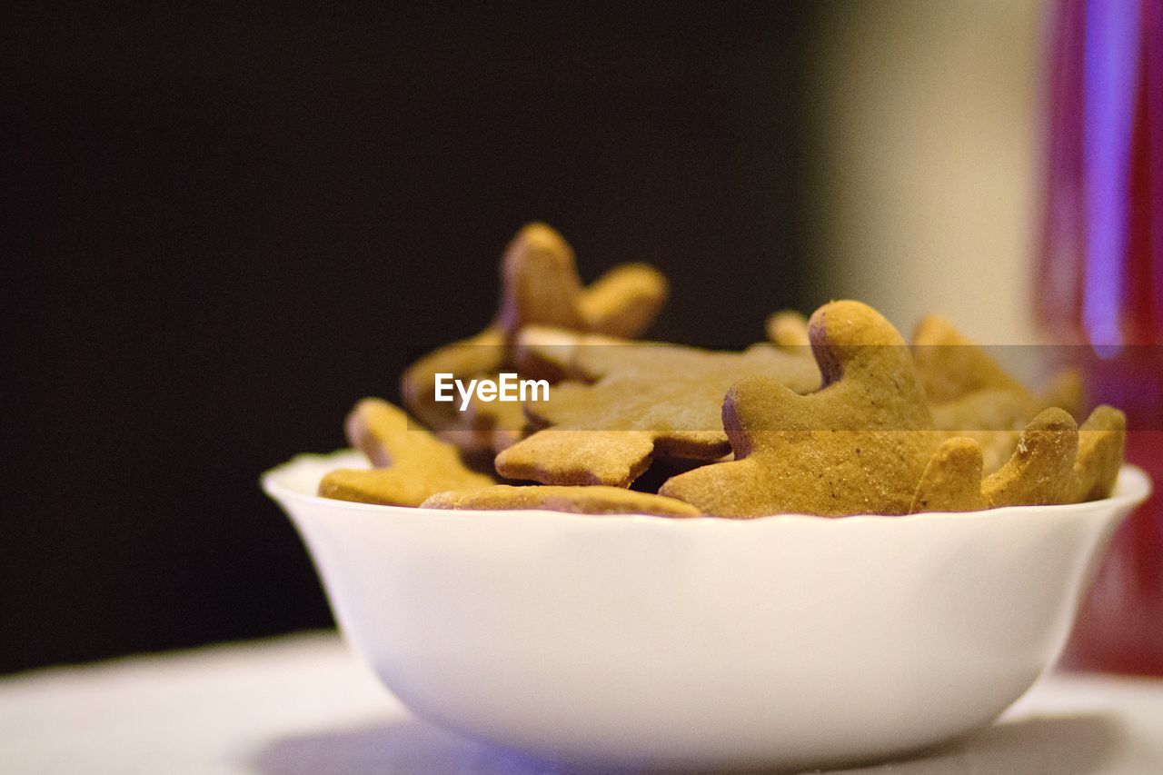 Close-up of cookies in bowl on table at home