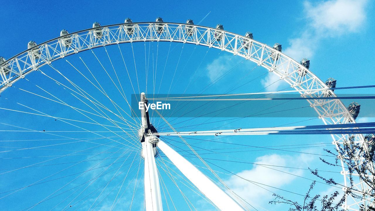 LOW ANGLE VIEW OF FERRIS WHEEL AGAINST SKY