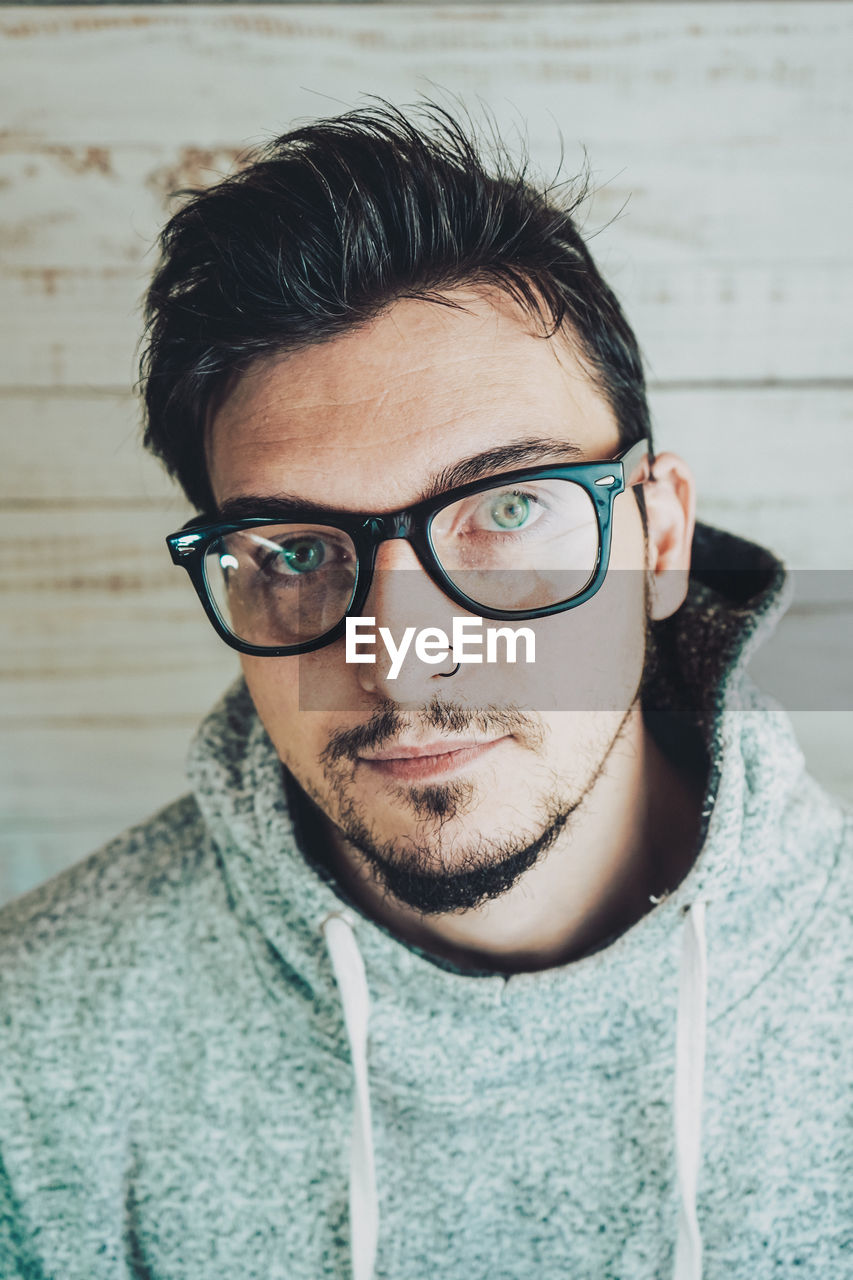 Portrait of man wearing eyeglasses