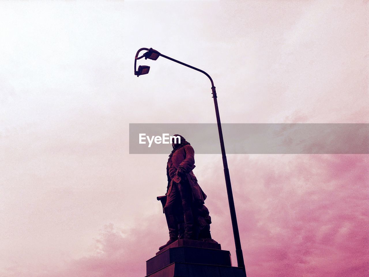 STATUE OF STREET LIGHT AGAINST SKY