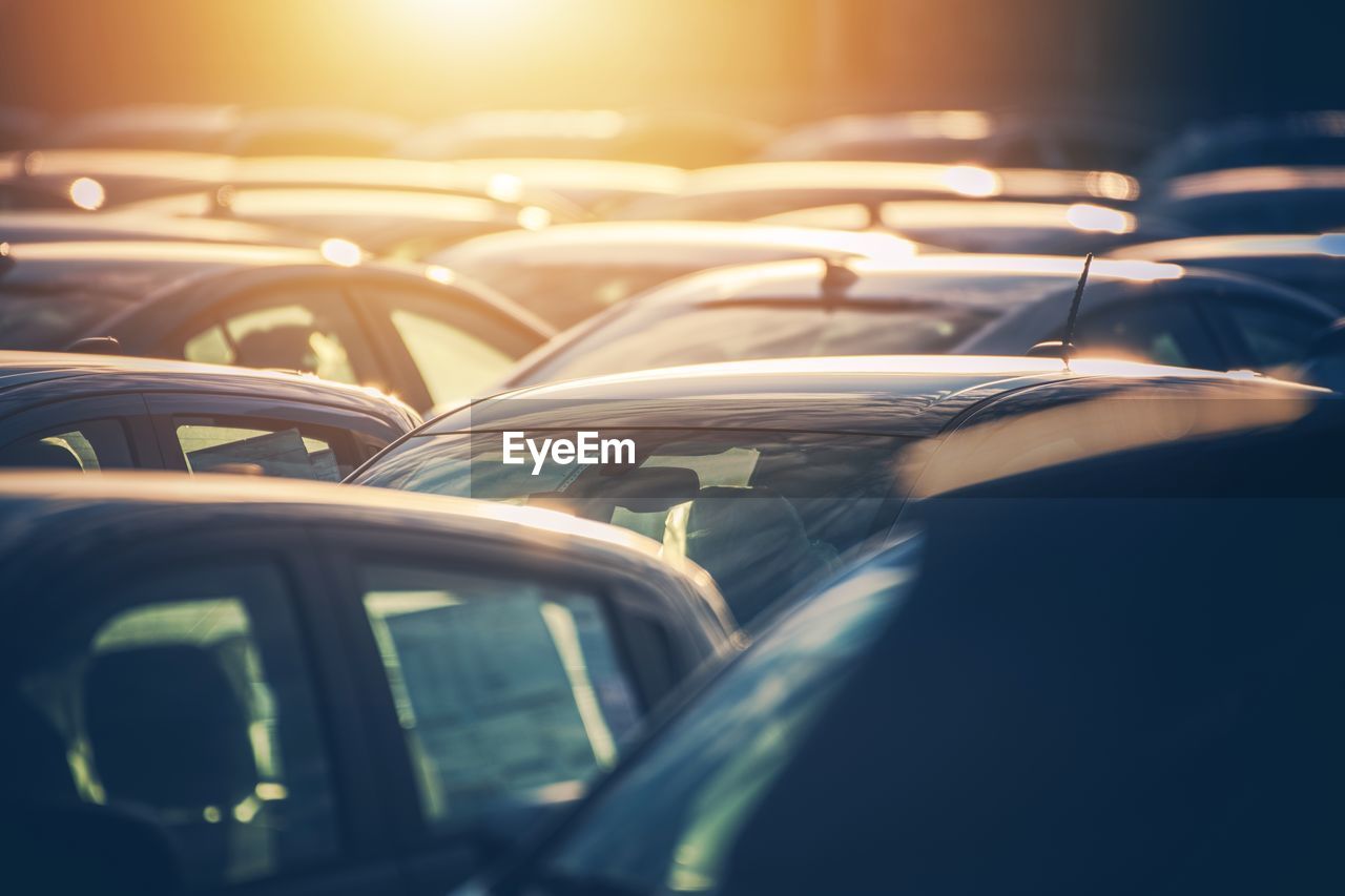 Close-up of cars during sunset