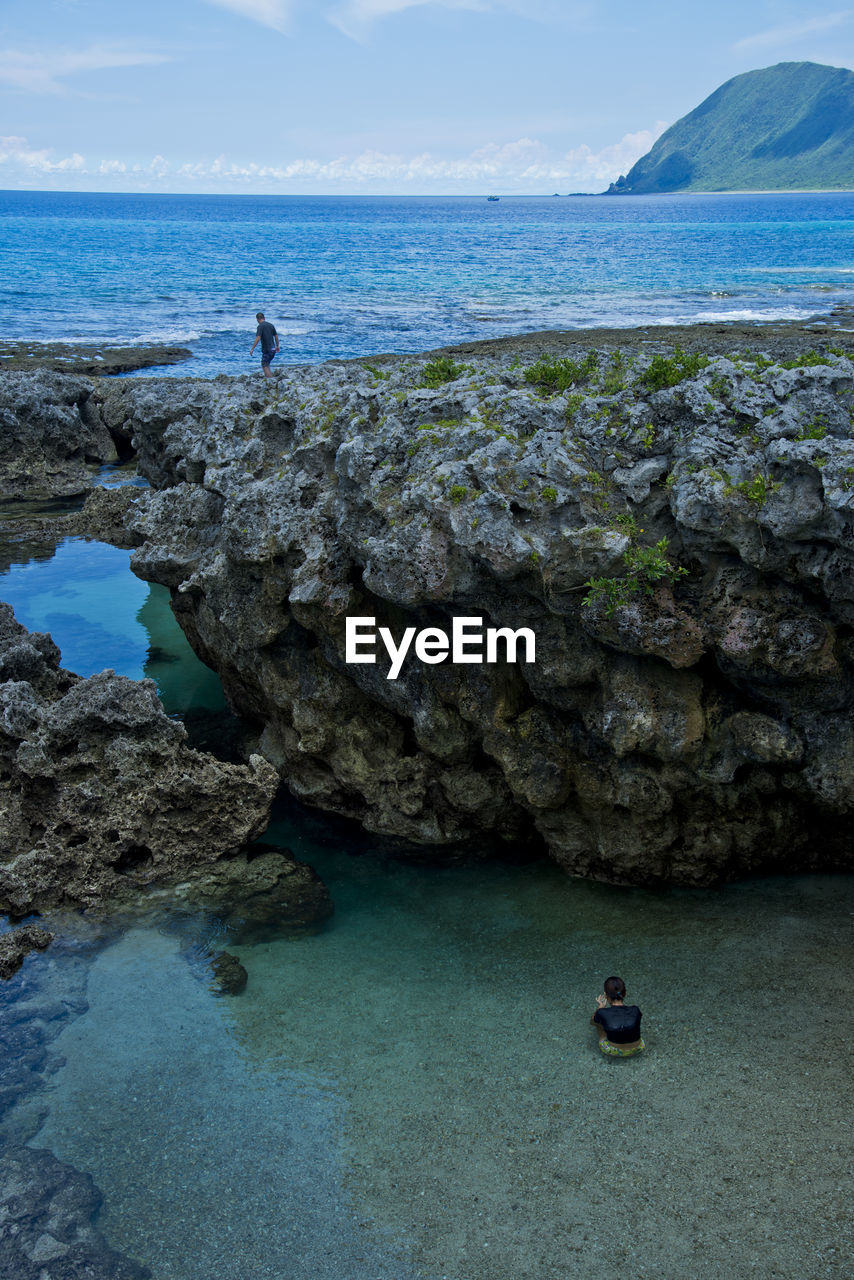 SCENIC VIEW OF SEA AND ROCK FORMATION