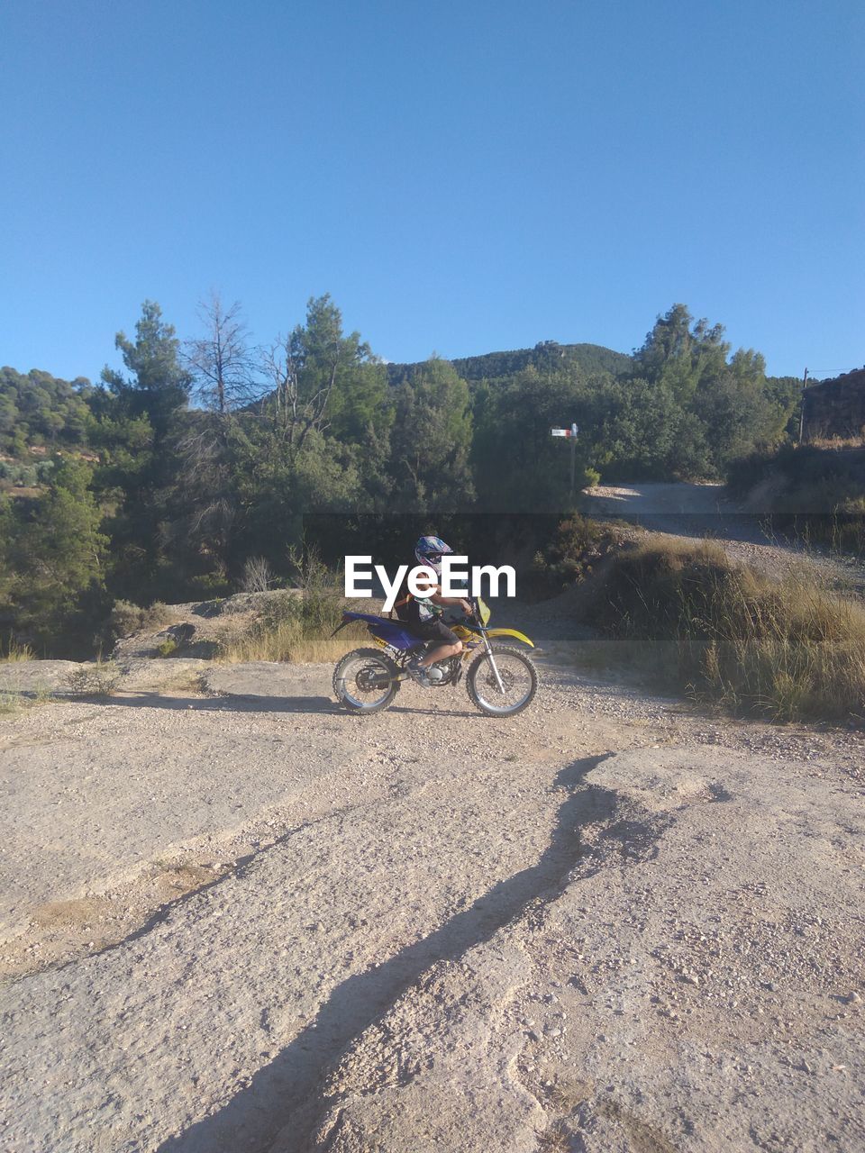 BICYCLE PARKED ON LANDSCAPE AGAINST CLEAR SKY