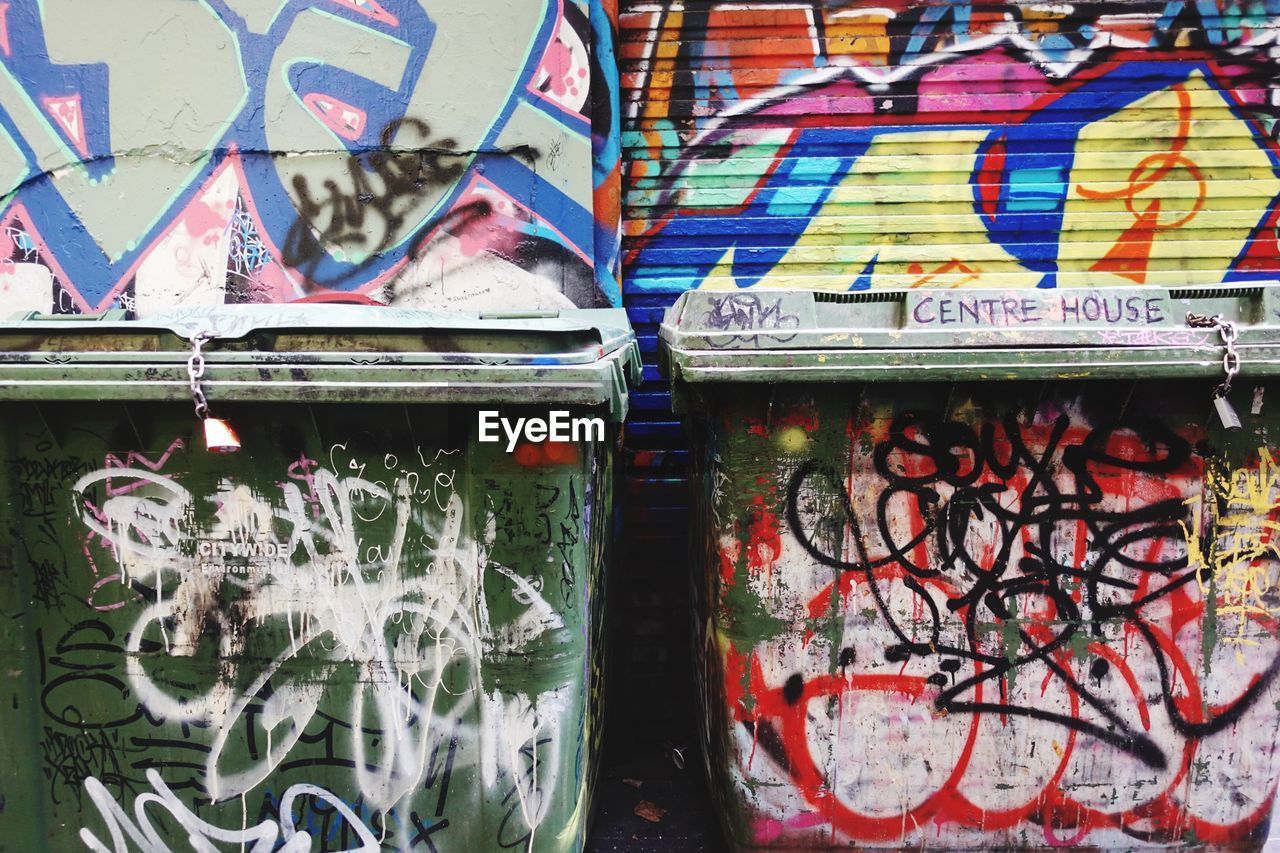 Two dumpster covered in graffiti. in melbourne, australia