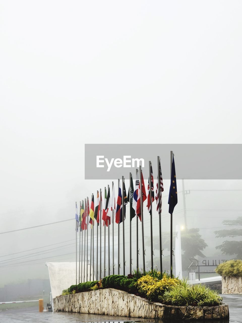 nature, sky, water, fog, copy space, day, in a row, vehicle, no people, architecture, outdoors, transportation, lake, built structure, plant