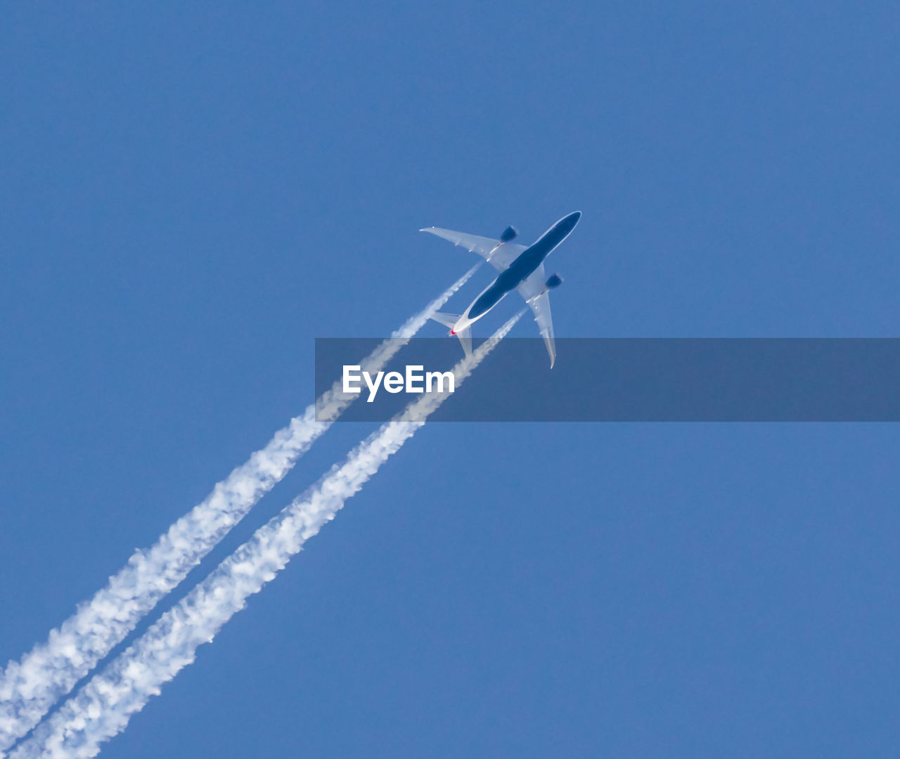 Low angle view of airplane flying in sky