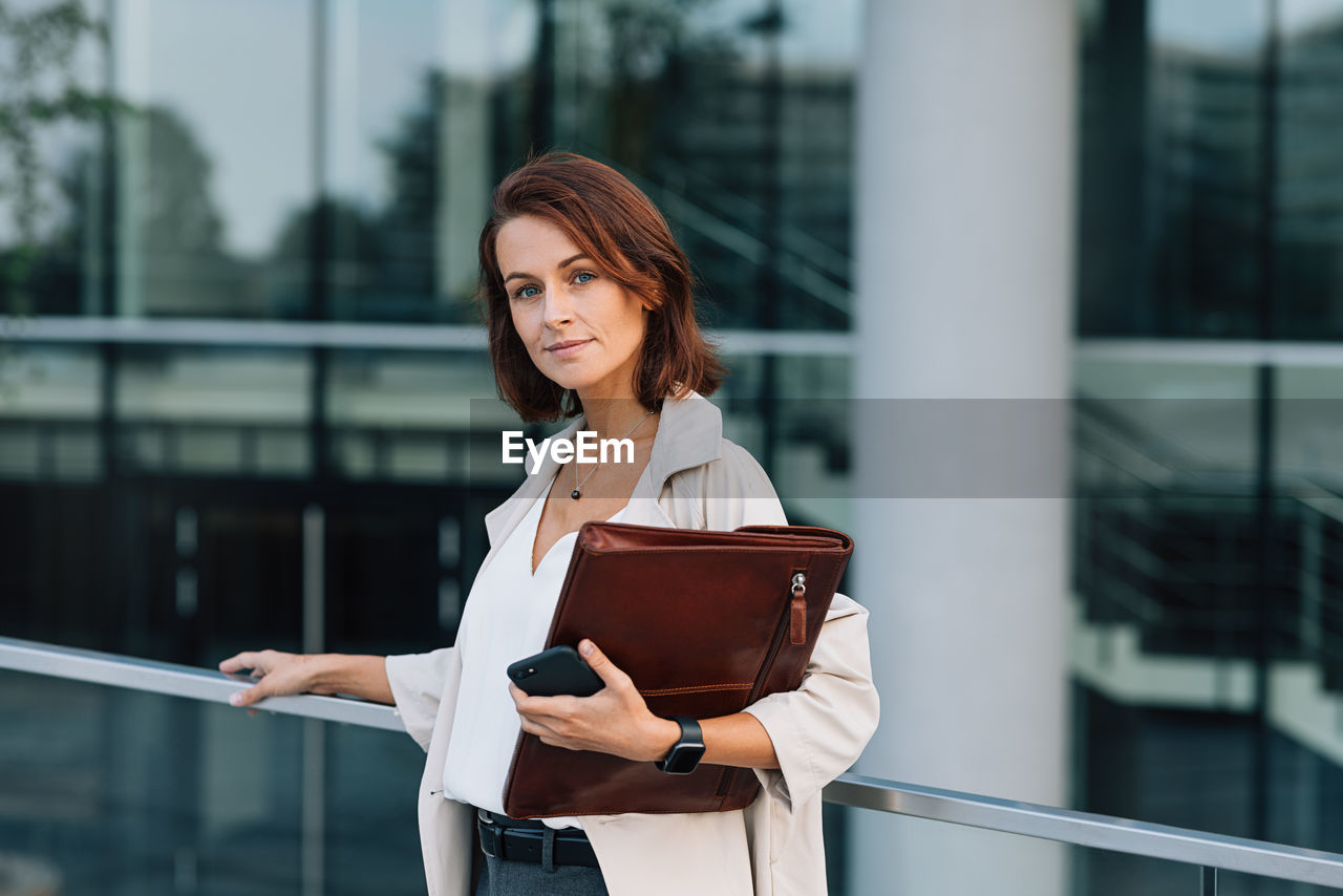 portrait of young woman using mobile phone