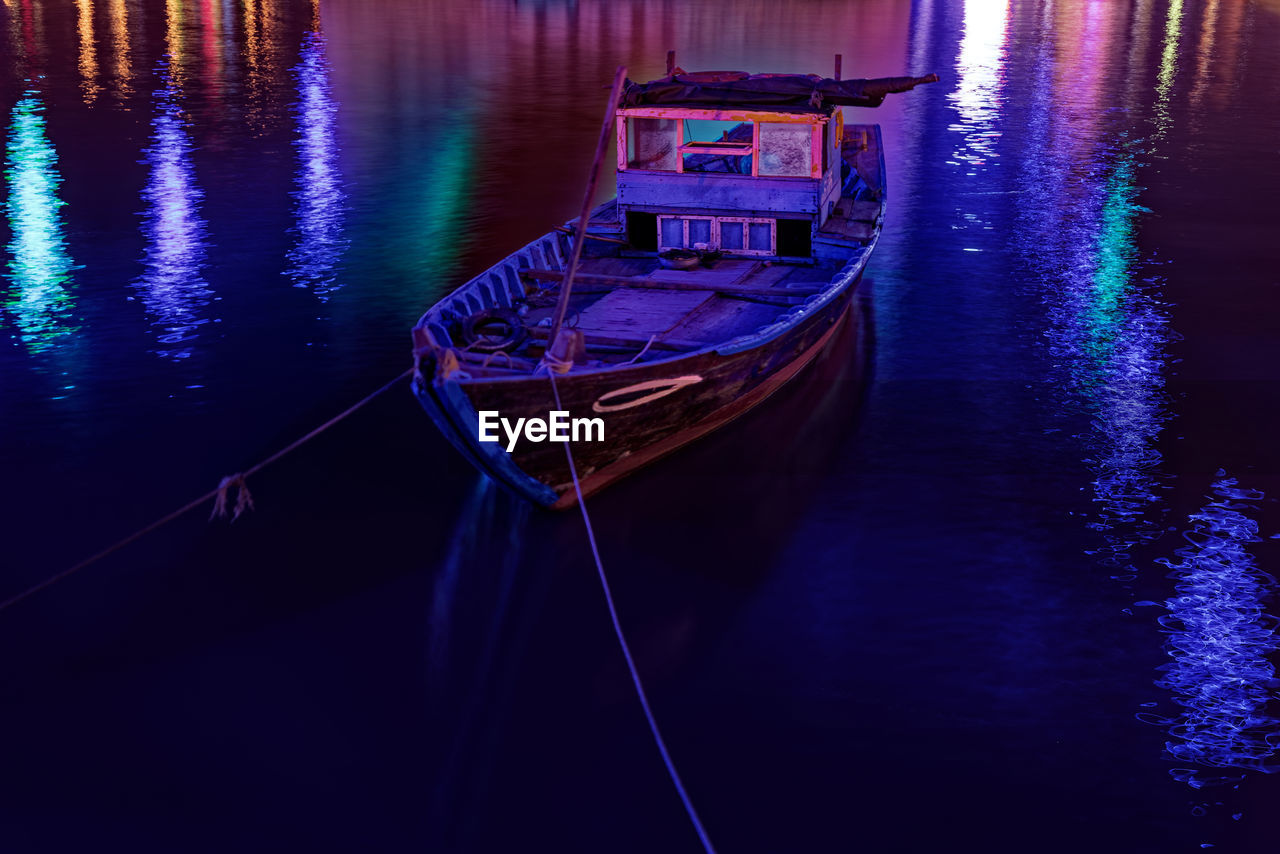 High angle view of boat moored in lake