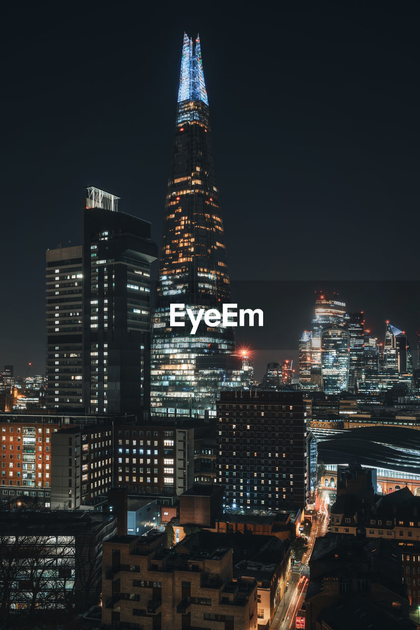 Illuminated buildings in city at night